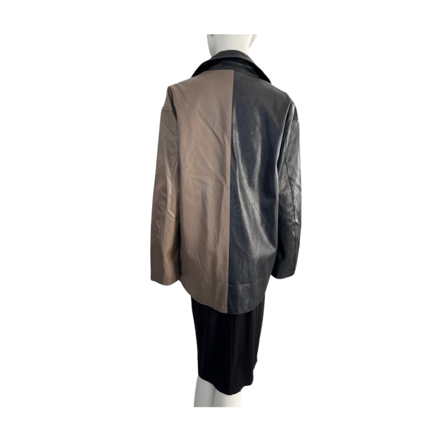 Mannequin wearing a two-tone leather jacket with brown and black sections on a white background