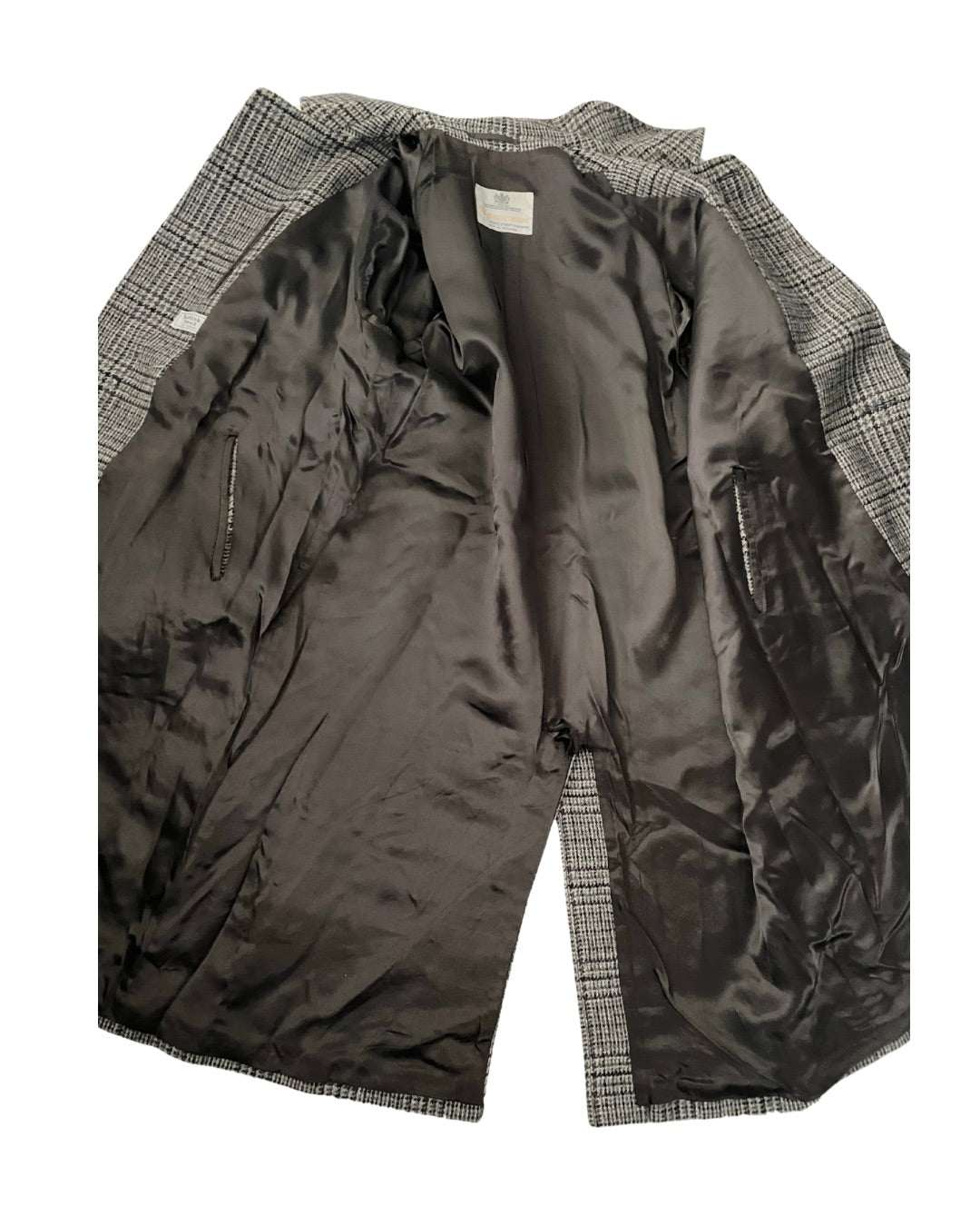 Dark gray jacket with plaid lining on a white background