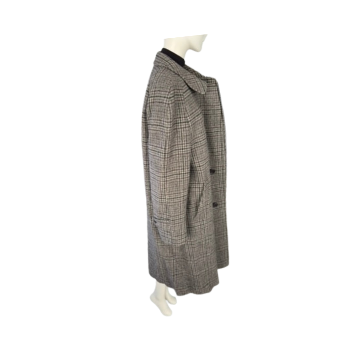 Plaid coat on a mannequin against a white background