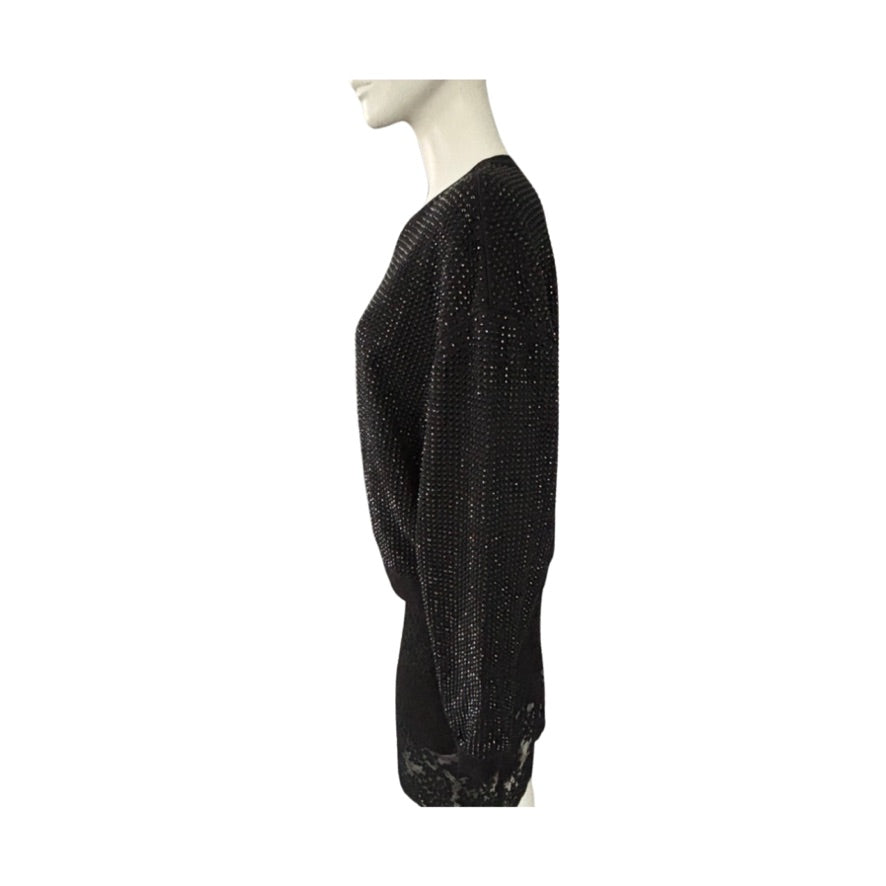Black textured sweater on a mannequin against a white background