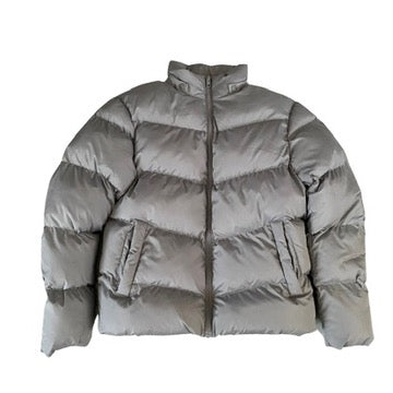 Grey puffer jacket on a white background