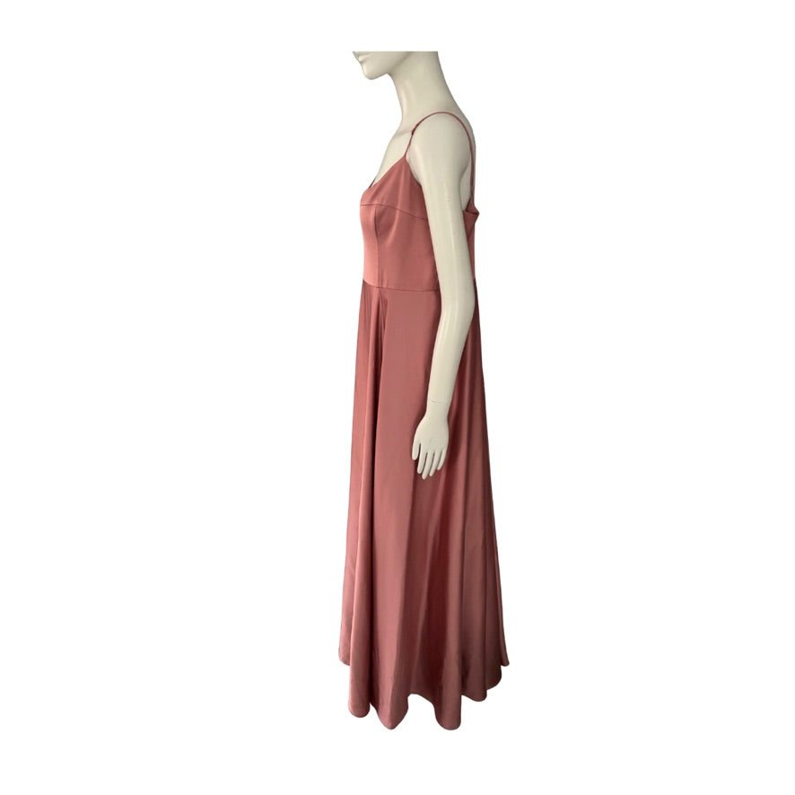 Mannequin wearing a long pink dress on a white background