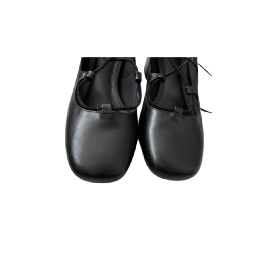 Pair of black leather shoes on a white background