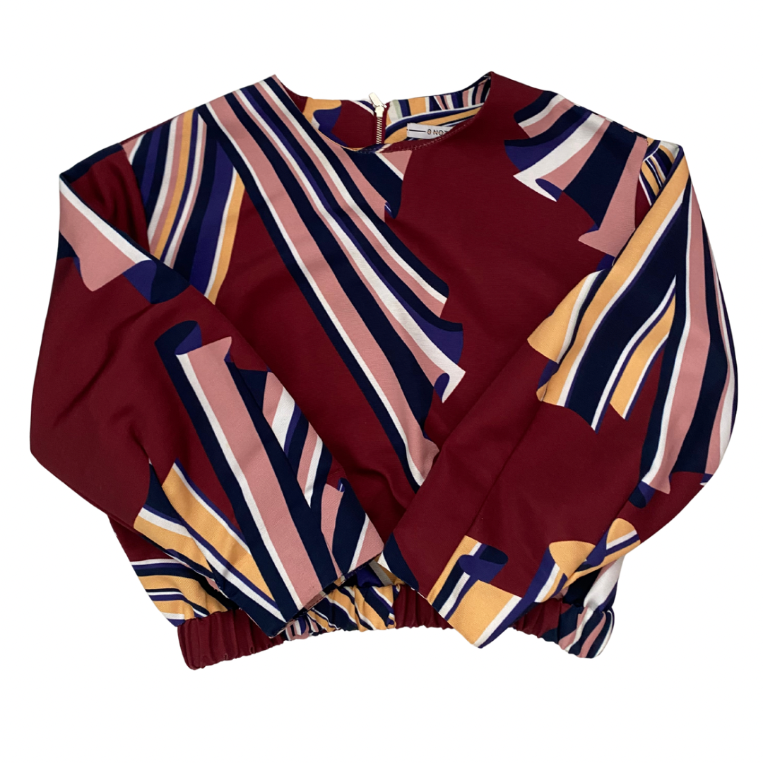 Colorful patterned top on a white background