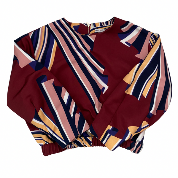 Colorful patterned top on a white background