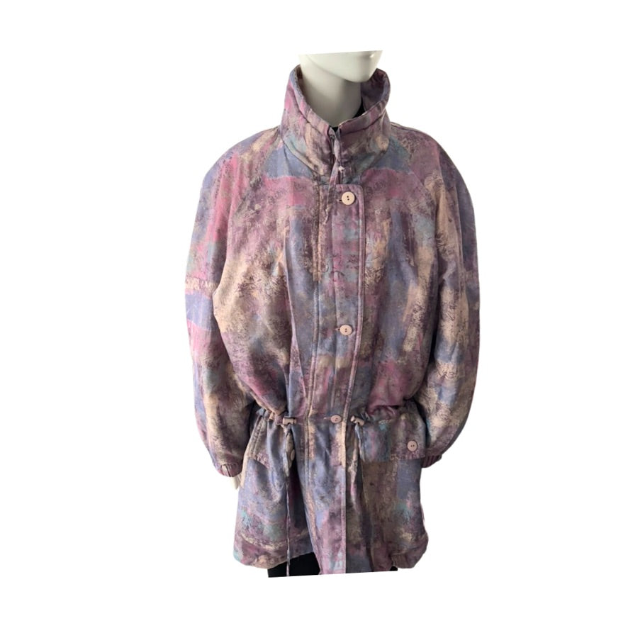 Multicolored coat on a mannequin against a white background