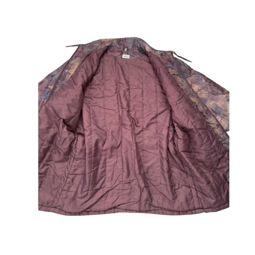 Purple quilted cover with camouflage pattern on a white background