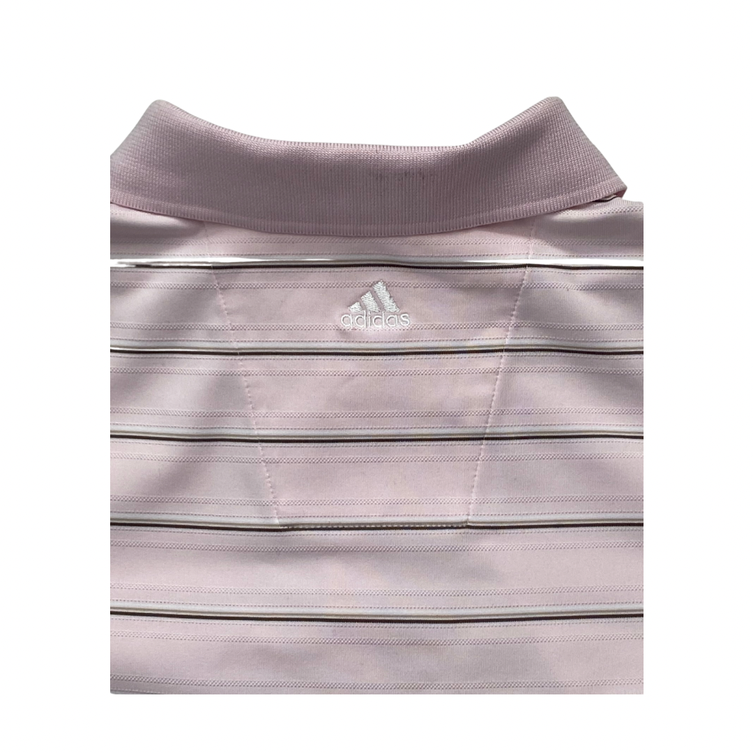 Close-up of a light pink Adidas polo shirt with collar and chest logo.