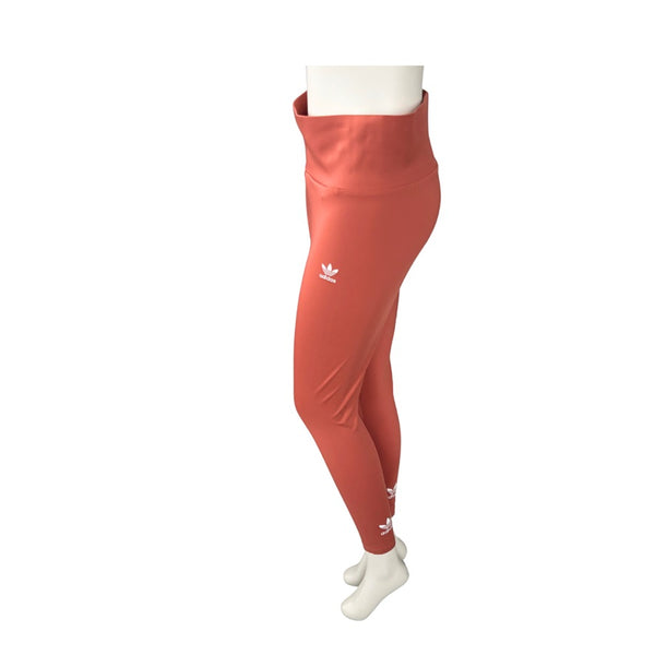 Orange Adidas leggings on a white background