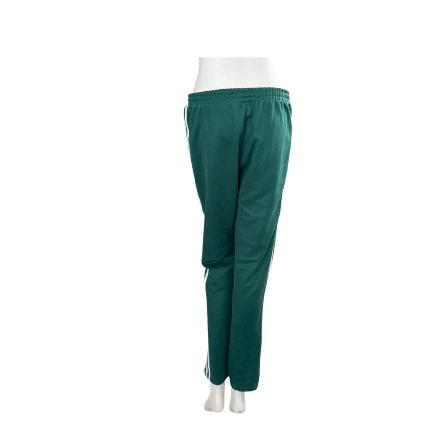 Green pants on a mannequin against a white background