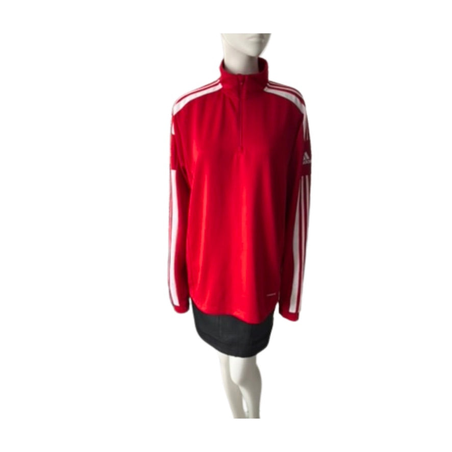 Red Adidas tracksuit on a mannequin against a white background