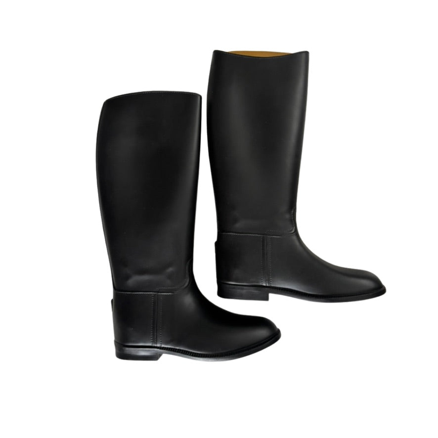 Pair of black riding boots on a white background