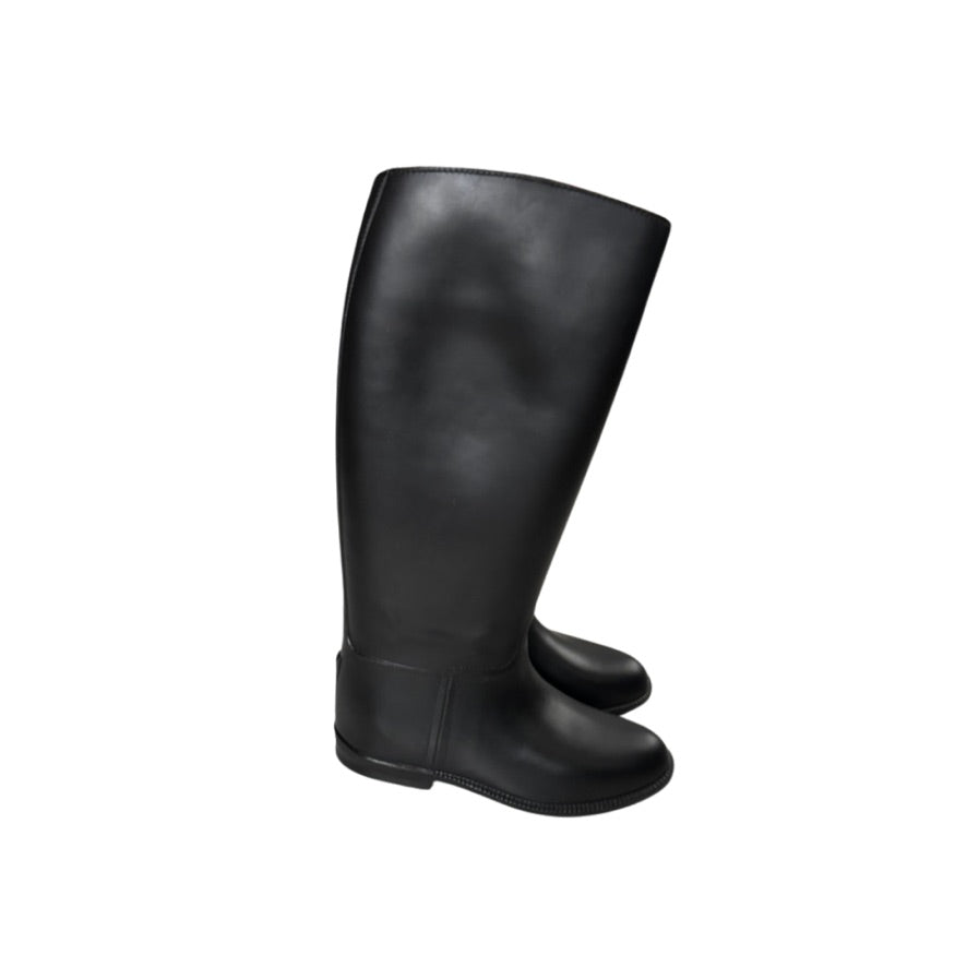 Black riding boots on a white background