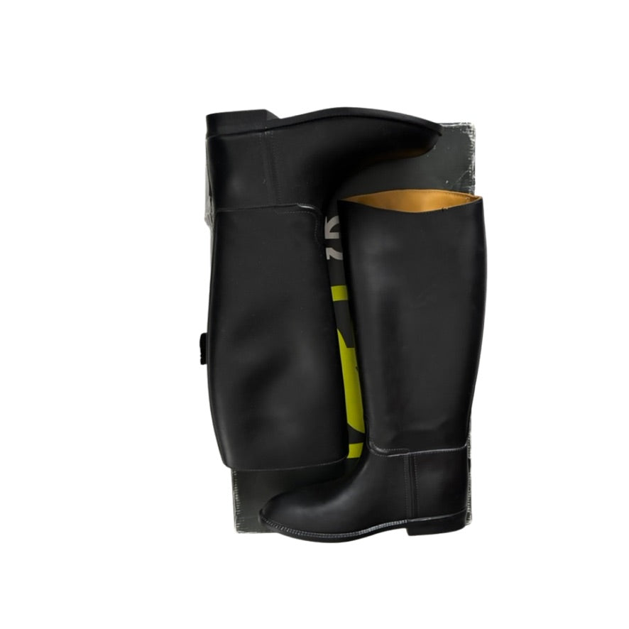 Black rubber boot with yellow interior on a white background