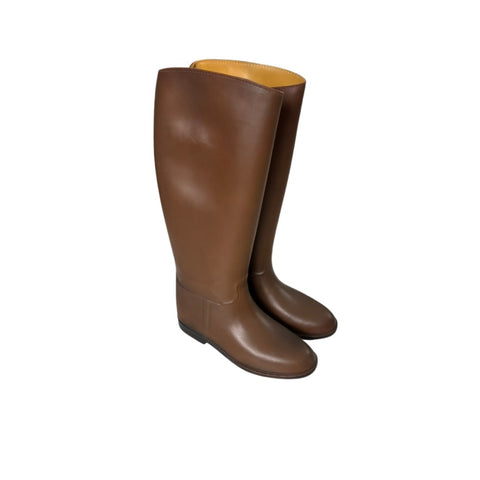 Pair of brown riding boots on a white background