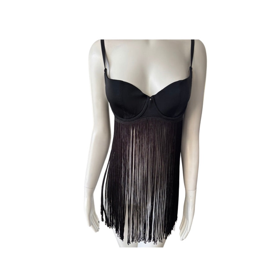 Black fringe dress on a mannequin against a white background