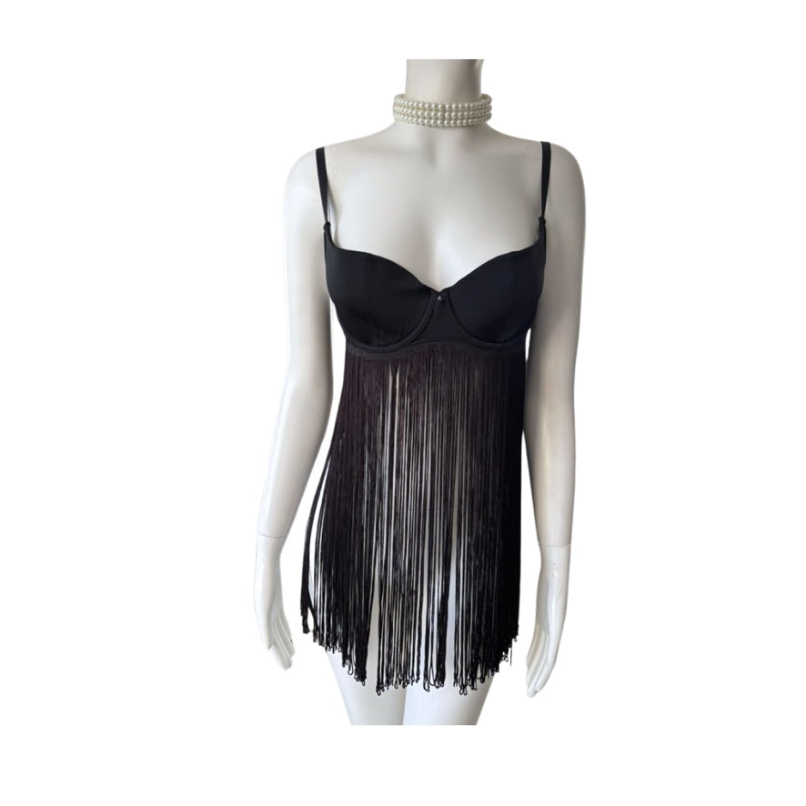 Black fringe dress on a mannequin against a white background