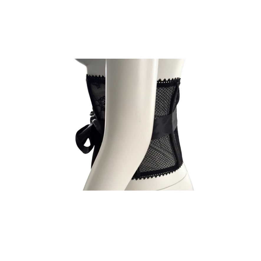 Black lace waspie belt on a mannequin against a white background