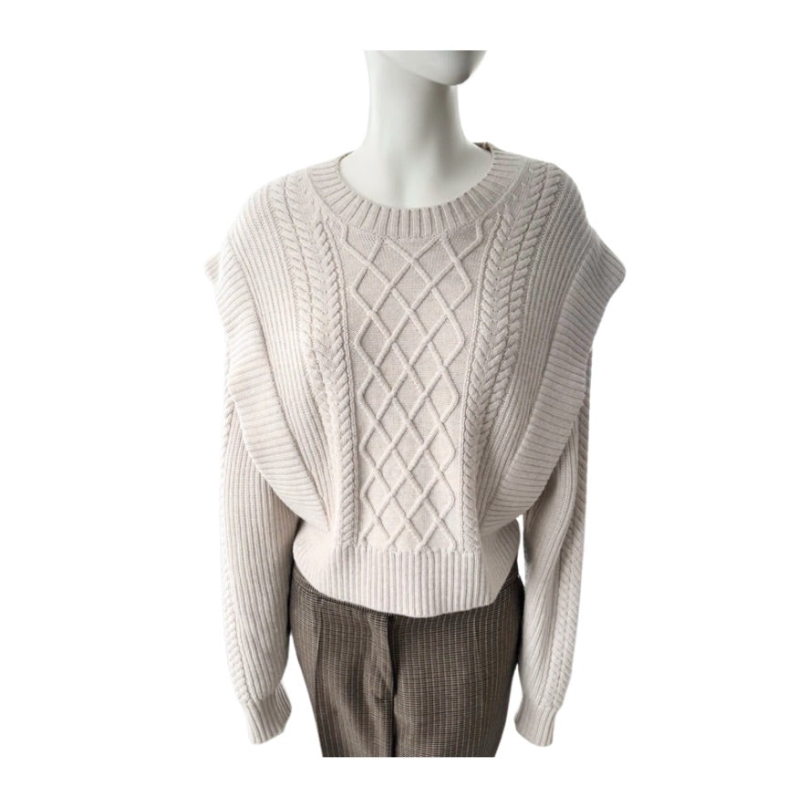 Mannequin wearing a beige cable knit sweater on a white background
