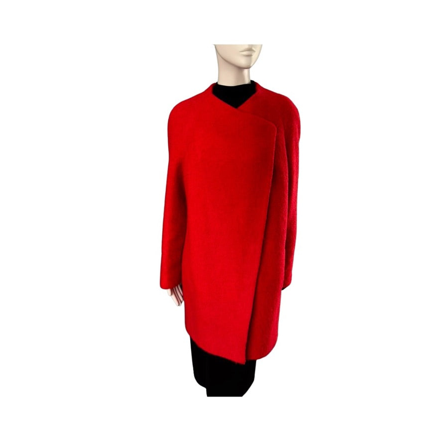Red coat on a mannequin against a white background