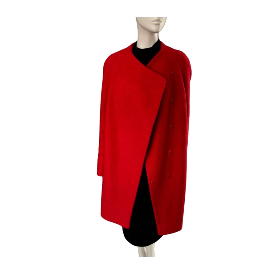 Red coat on a mannequin against a white background