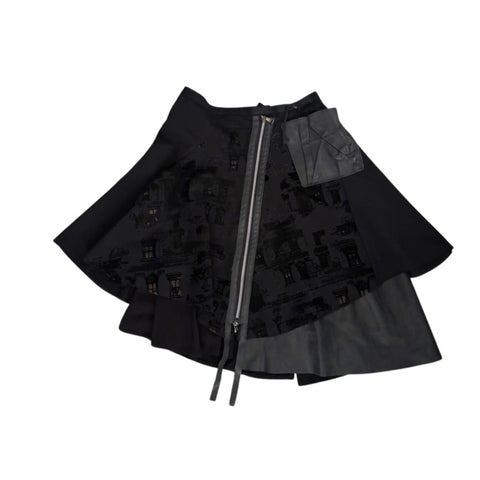 Black layered skirt with zipper on a white background