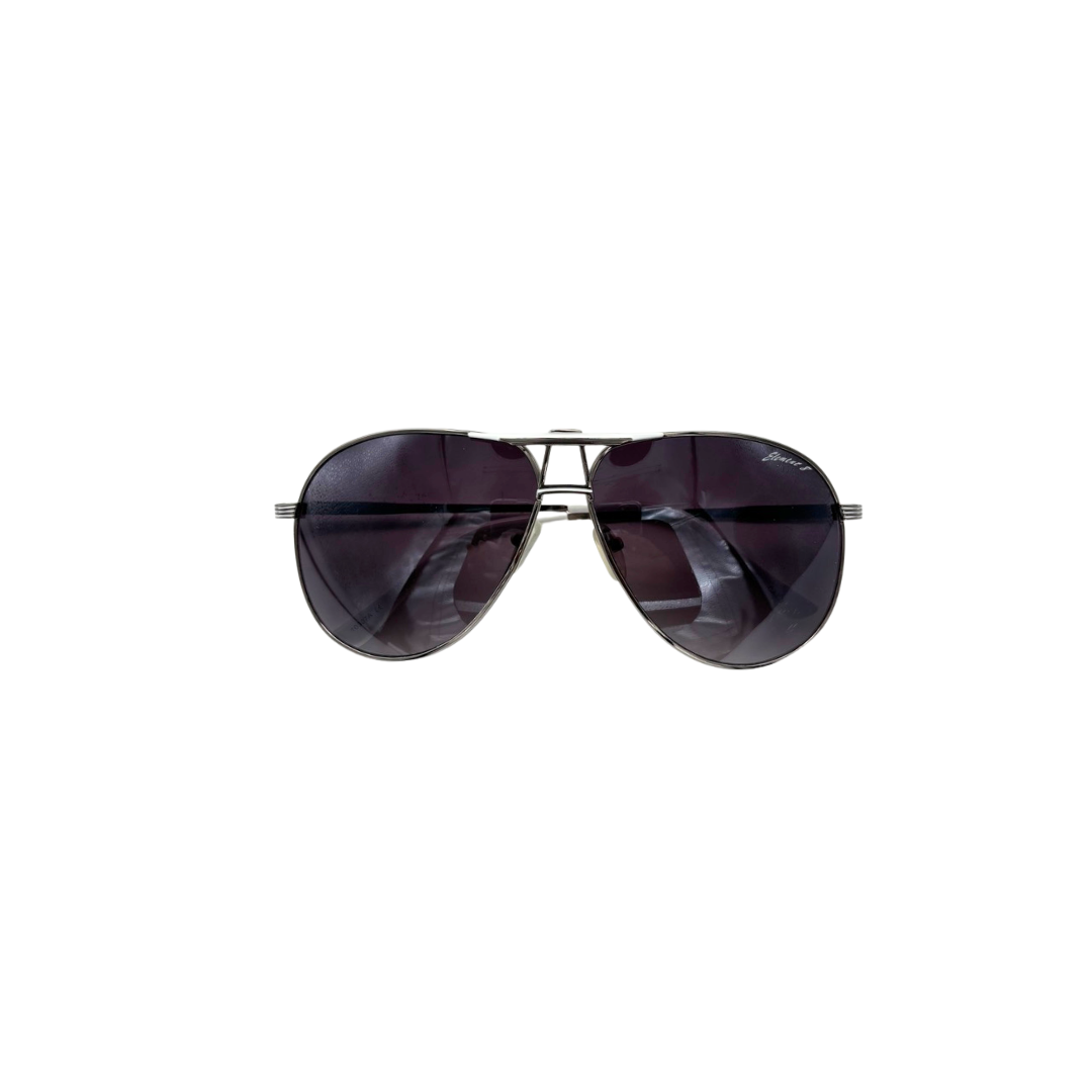 Aviator sunglasses with dark lenses on a white background