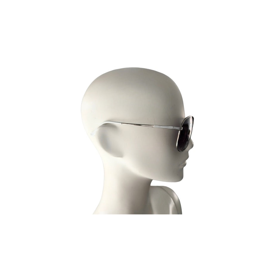 Sunglasses on a mannequin head against a white background
