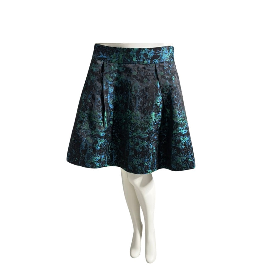 Blue patterned skirt on a white mannequin against a white background