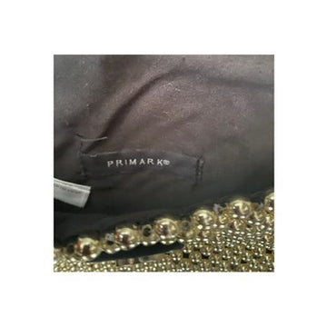 Primark label on black fabric a white background