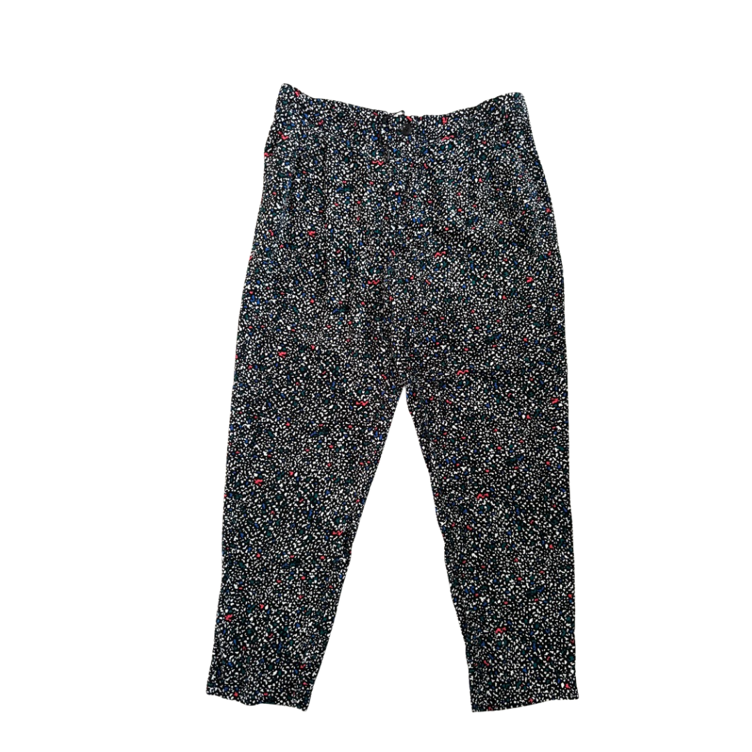 Black speckled pants on a white background