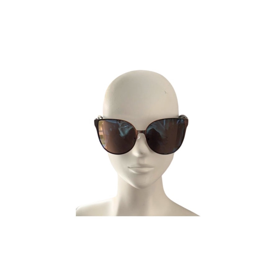 Sunglasses on a mannequin head against a white background