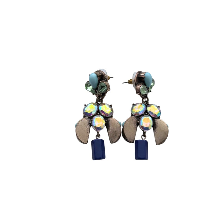Pair of earrings with colorful gemstones and blue accents on a white background