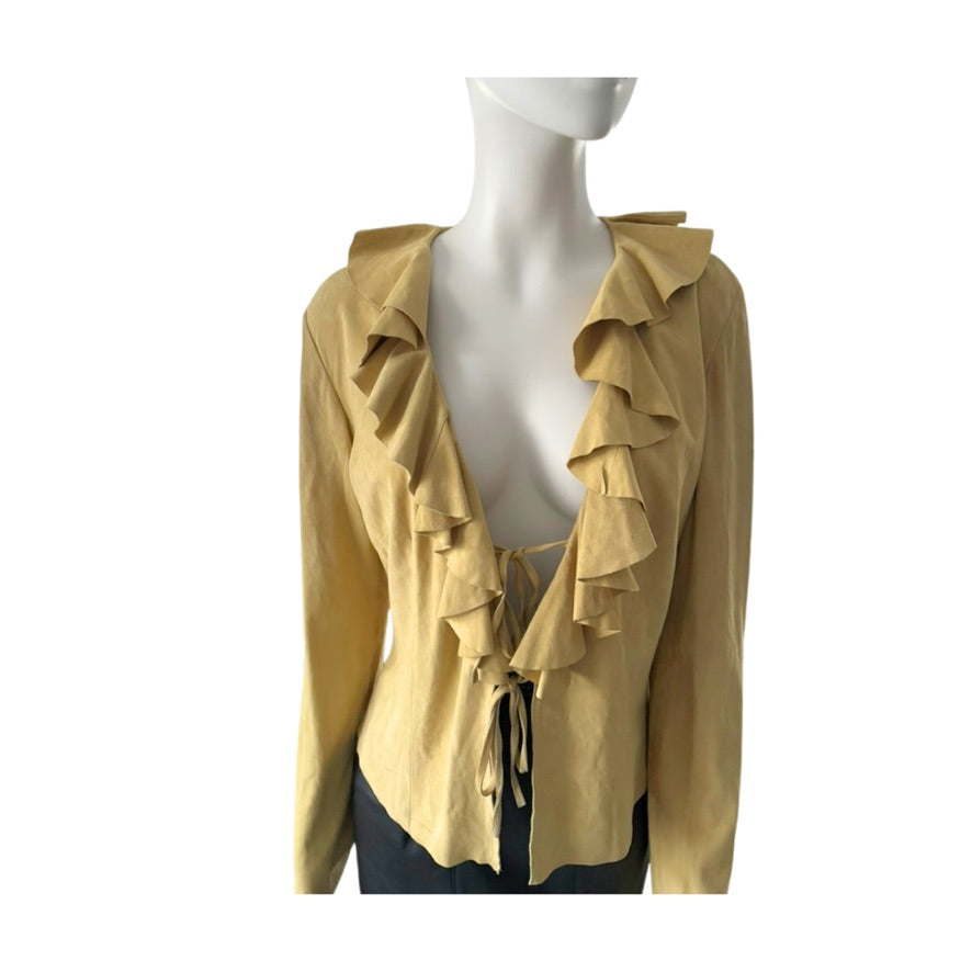 Yellow ruffled blouse on a mannequin against a white background