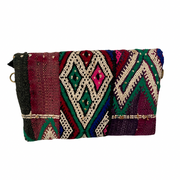 Multicolored patterned clutch bag on a white background