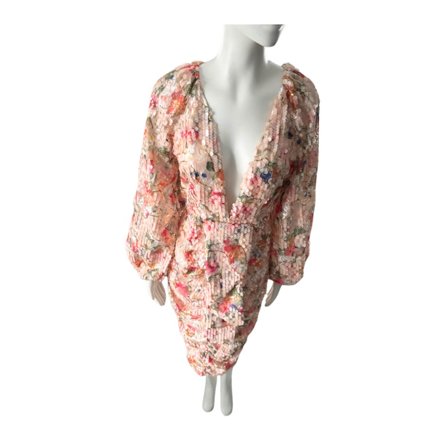 Floral dress on a mannequin against a white background