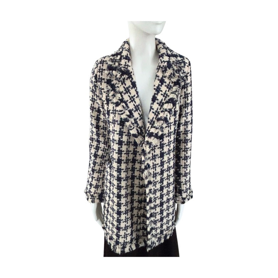 Mannequin wearing a patterned coat on a white background