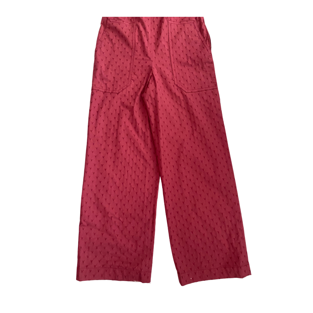 Red pants with a subtle pattern on a white background