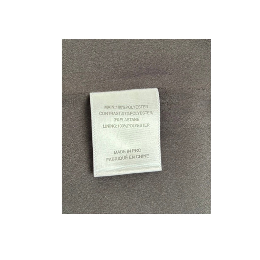 Textile label on a gray fabric background