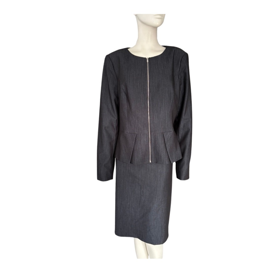 Grey suit on a mannequin against a white background