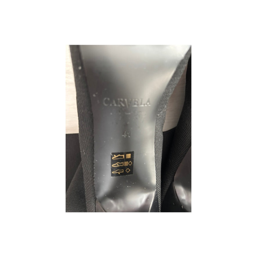 Close-up of a shoe sole with 'Carvela' branding on a white background