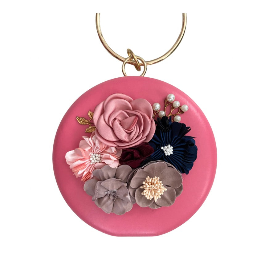 Pink bag with floral decorations on a white background