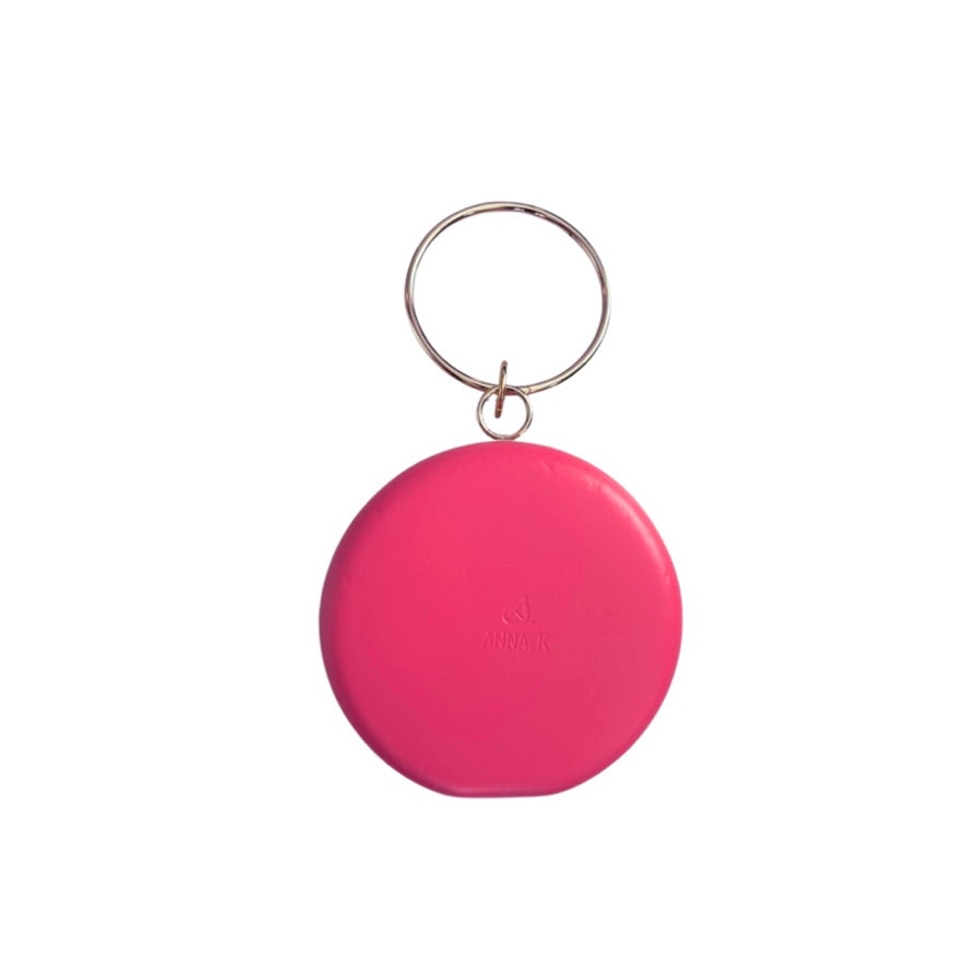 Pink bag with a ring on a white background