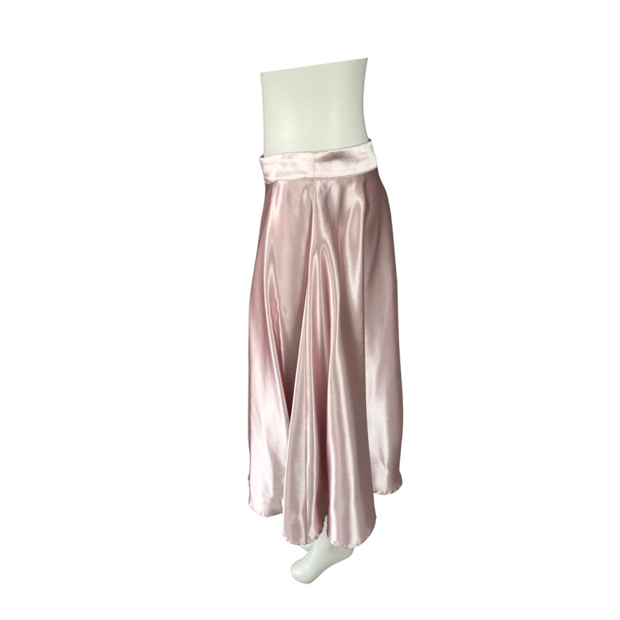 Pink satin skirt with white top on a white background