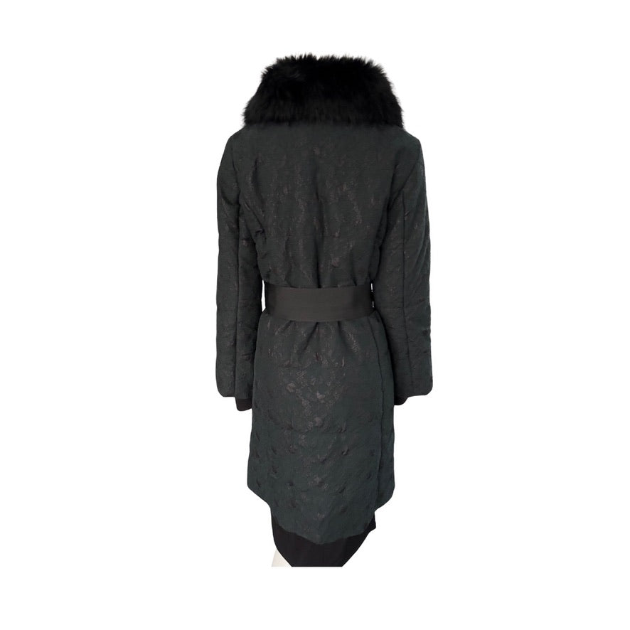 Black quilted coat with fur hood on a white background