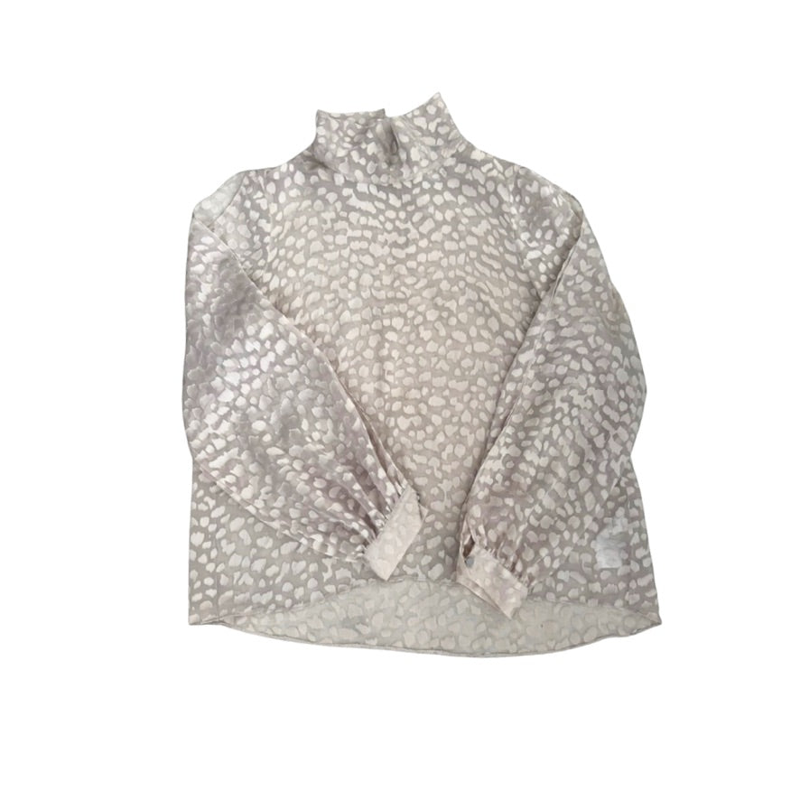 Light grey patterned blouse on a white background