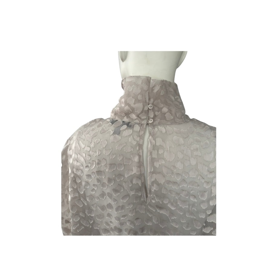 Mannequin wearing a patterned gray jacket on a white background