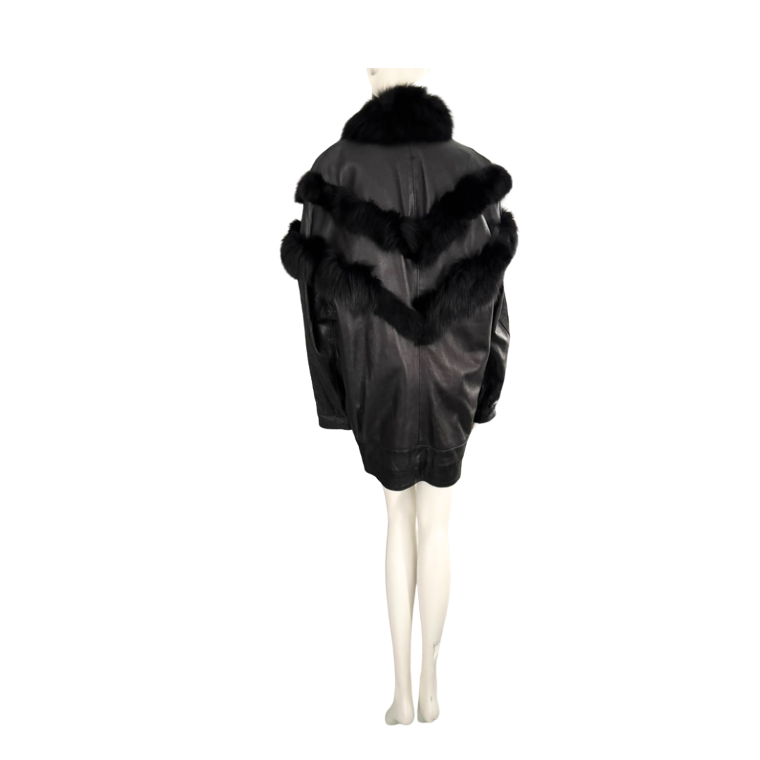 Black coat with fur trim on a mannequin against a white background