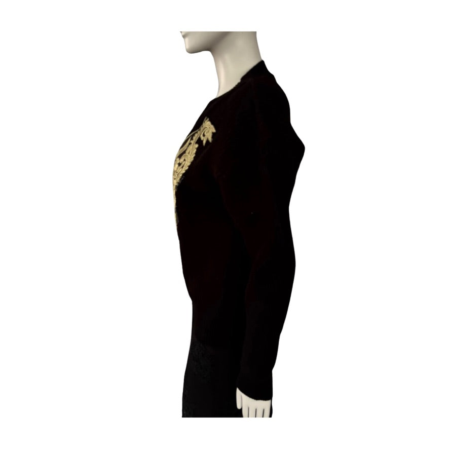 Black jumper with gold embroidery on a mannequin against a white background