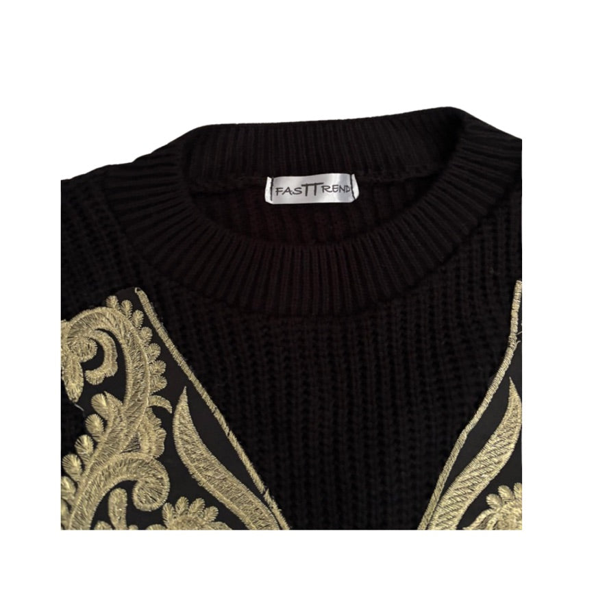 Black sweater with gold embroidery and 'Fast Tram' label on a white background